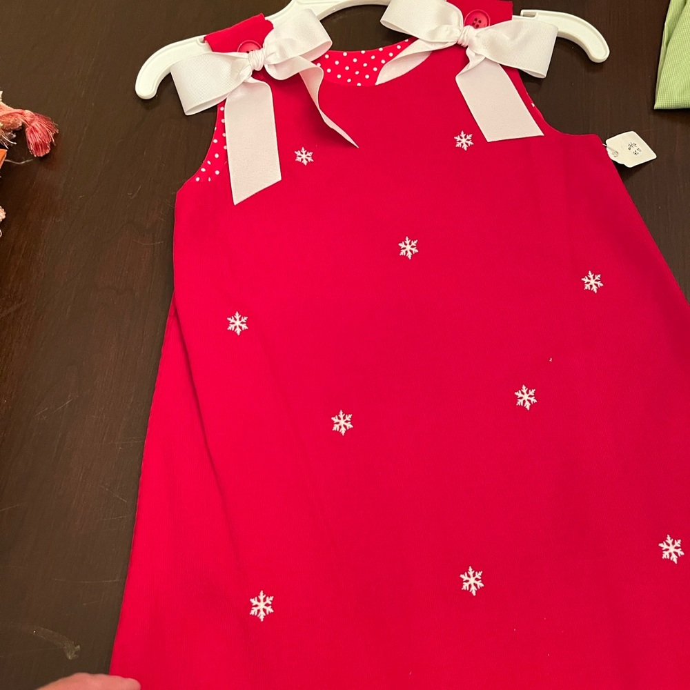 Red Reversible Jumper with Removable White Bows. Embroidered with Snowflakes.